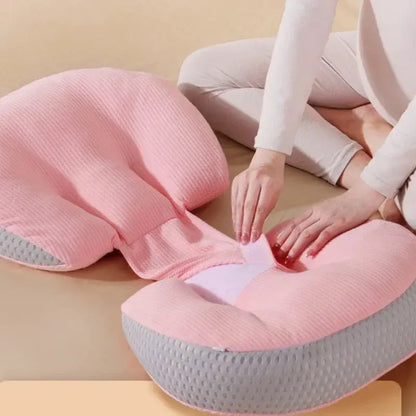  A pregnant woman comfortably resting with a C-shaped pregnancy pillow, designed to provide full-body support for the belly, lower back, and hips. Made from breathable, hypoallergenic fabric, this ergonomic pillow promotes healthy posture, reduces pressure on the spine, and enhances sleep quality. Perfect for sleeping, lounging, or postpartum nursing.