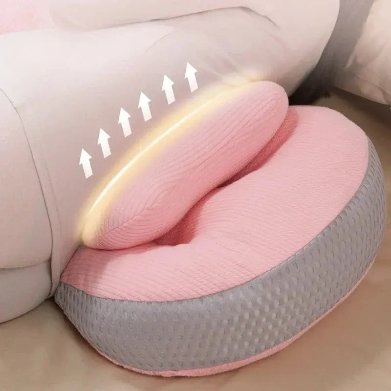  A pregnant woman comfortably resting with a C-shaped pregnancy pillow, designed to provide full-body support for the belly, lower back, and hips. Made from breathable, hypoallergenic fabric, this ergonomic pillow promotes healthy posture, reduces pressure on the spine, and enhances sleep quality. Perfect for sleeping, lounging, or postpartum nursing.
