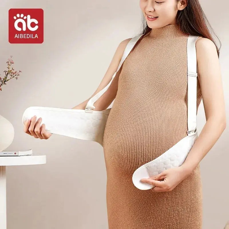 Baby Belly Support Belt for pregnancy, made from 100% cotton knitted fabric for breathable, gentle support. Reduces pressure on the back and pelvic area, alleviating lower back pain, pelvic discomfort, and pregnancy strains. Adjustable adhesive fit ensures a secure, comfortable wear for expectant moms in any trimester.